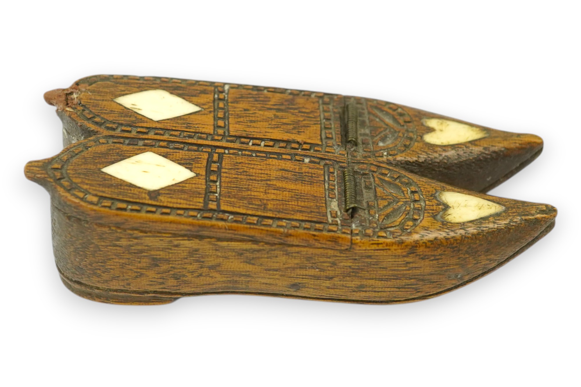 An early 19th century bone inset carved wood 'pair of shoes' snuff box with damaged sprung lid, 9.5cm long. Condition - good